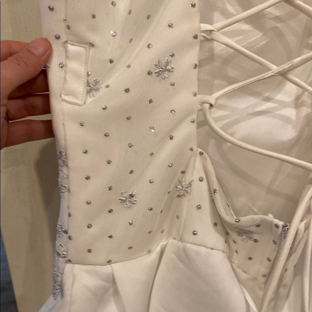 Elegant White Wedding Dress with Intricate Embroidery - Picture 9 of 14